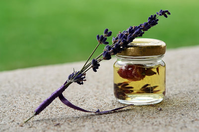 Picture flower leaning on a herbal in a jar of oil